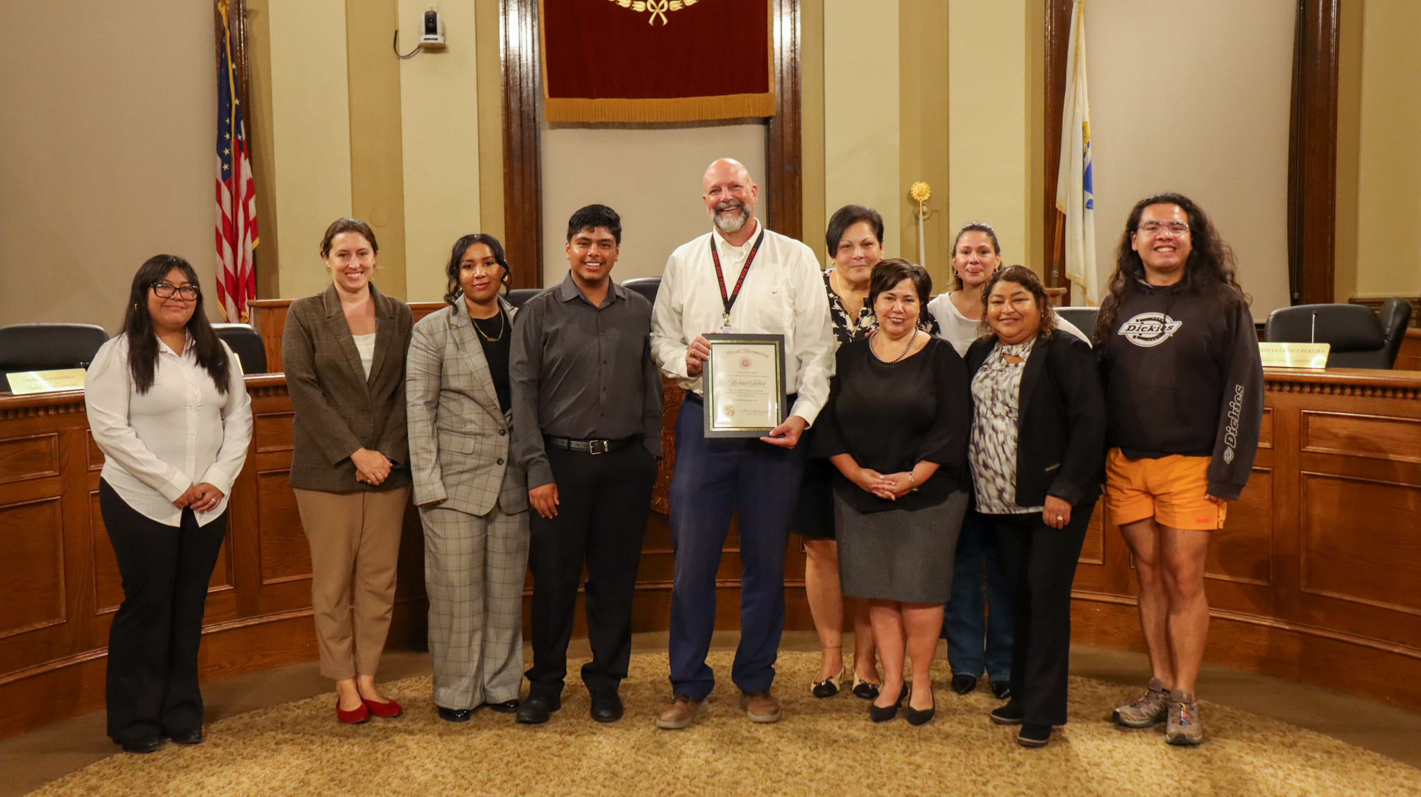 Michael Talbot pictured with Superintendent Dr. Almi G. Abeyta and the Chelsea School Committee