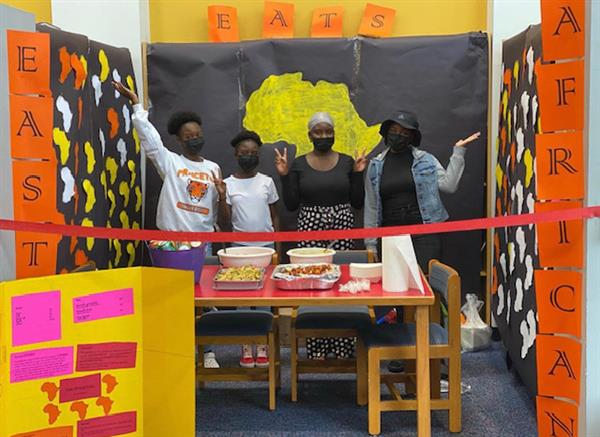 Edissa, Melize, Anne, and Ivona Niyonkinzo with “East African Eats” a food business.