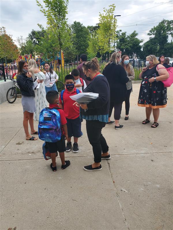 Students and staff gathered outside the Berkowitz Elementary School on the first day of school.