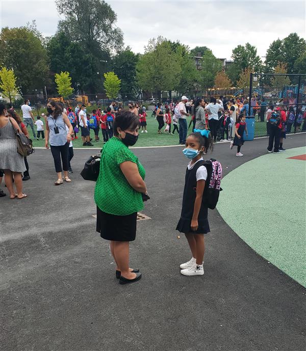 Superintendent Dr. Almi G. Abeyta met with a student outside the Mary C. Burke Elementary Complex on the first day of school.
