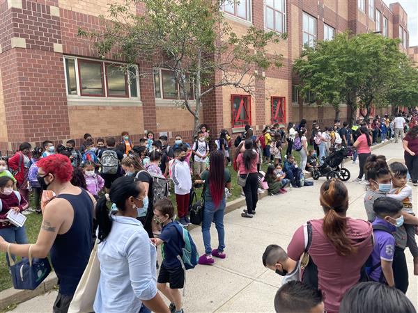 Students gathered outside the Mary C. Burke Elementary Complex to begin their first day of school. 