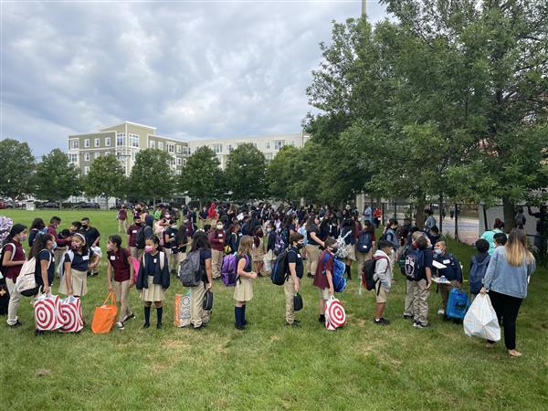 Students gathered outside the Mary C. Burke Elementary Complex to begin their first day of school. 