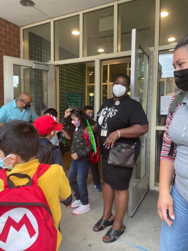 Principal Trelane Clark greeted students at the Hooks Elementary School on Wednesday morning. 