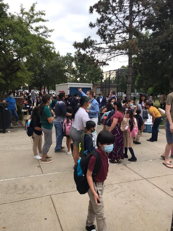 Students gathered outside the Mary C. Burke Elementary Complex to begin their first day of school. 