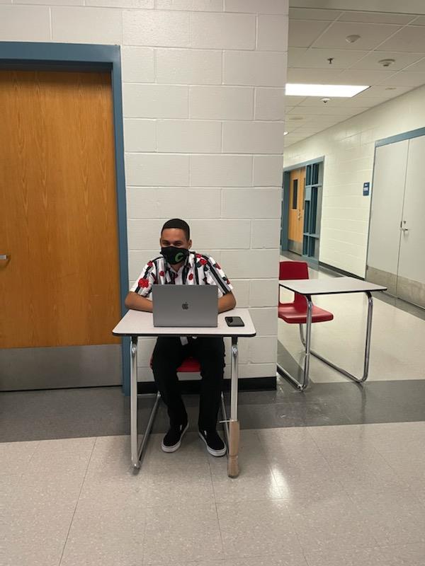 A student worked diligently at his desk during the first week of school at Chelsea High School. 