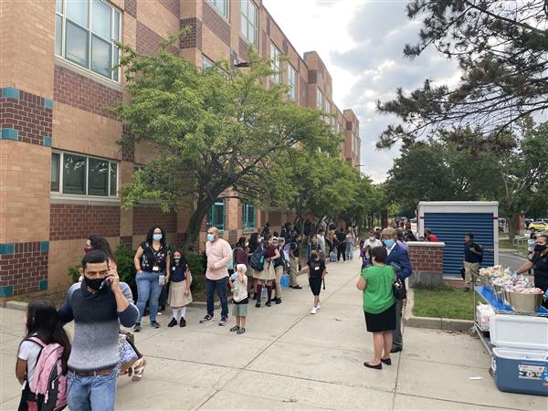 Students gathered outside the Mary C. Burke Elementary Complex to begin their first day of school.