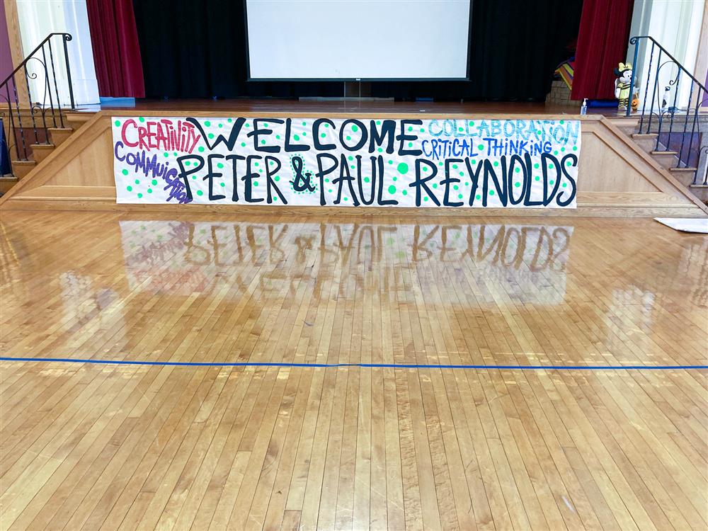 Early Learning Center students and teachers designed signage to present to the Reynolds brothers based on their own stories and illustrations.