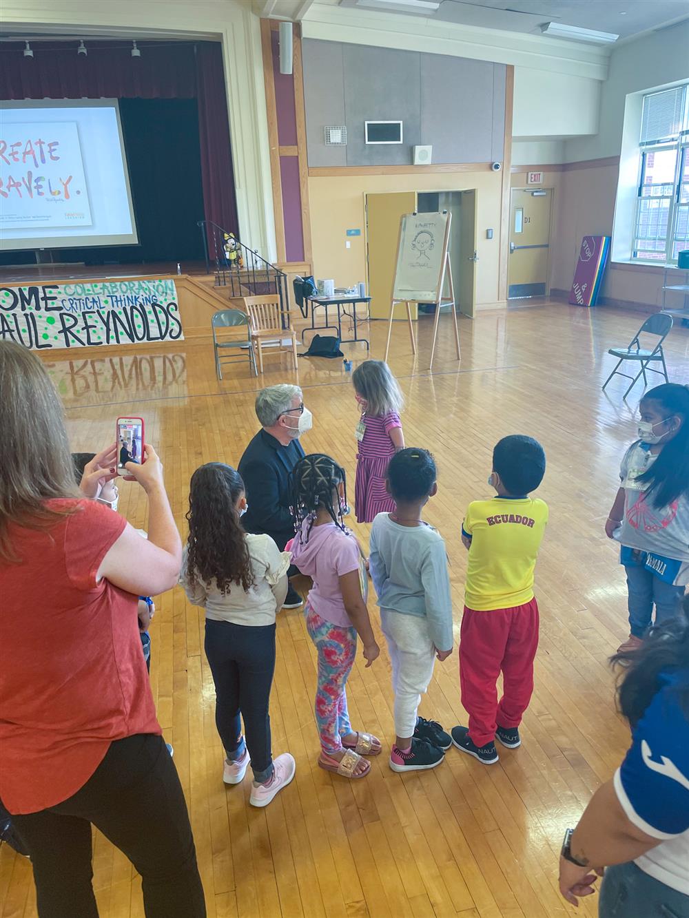 Peter Reynolds spoke with a group of young students at the Early Learning Center following his presentation on Friday.
