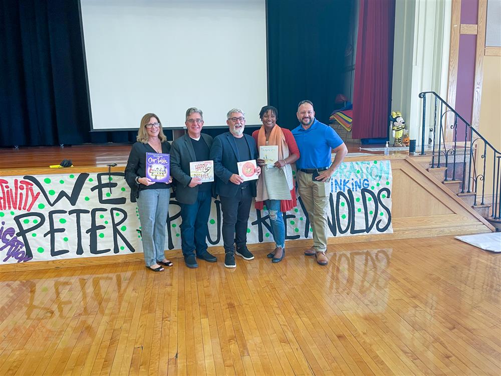 The Reynolds Brothers posed with Chelsea Public Schools and Early Learning Center staff.